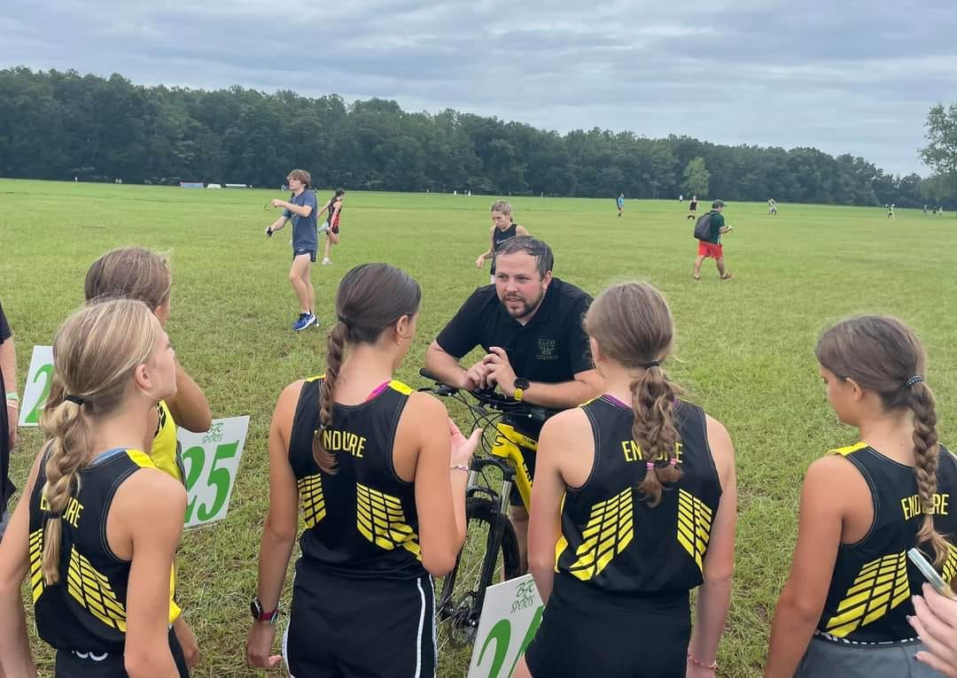 Elite distance runners training with professional coaches at Ocala Distance Project cross country practice in Florida